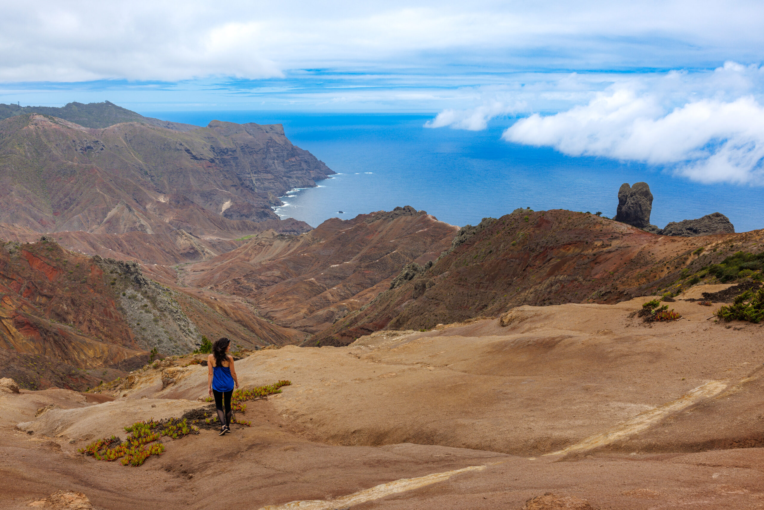 Person looking out over island and toward the sea